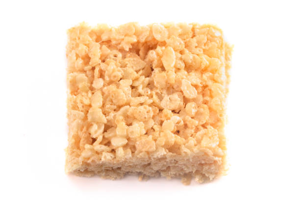 marshmallow crispy rice cereal treat bars isolated on a white background (en) - crispy photos et images de collection