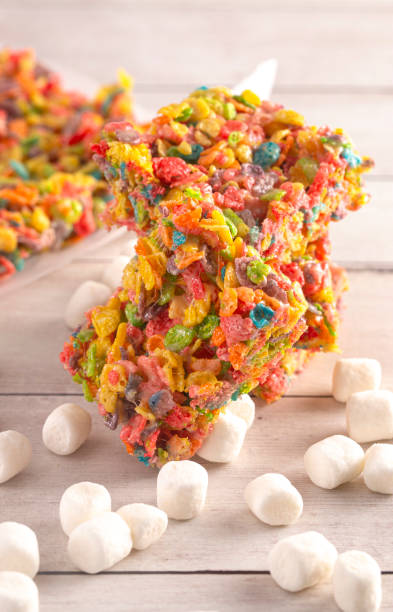 istock Fruity Cereal Marshmallow Treat Bars on a Light Wood Table 1157221761