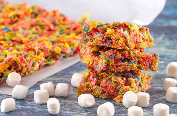 istock Fruity Cereal Marshmallow Treat Bars on a Blue Wooden Table 1157223815