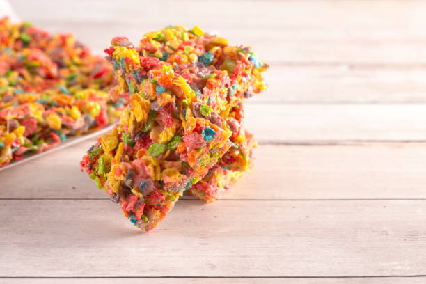 istock Fruity Cereal Marshmallow Treat Bars on a Light Wood Table 1157223870