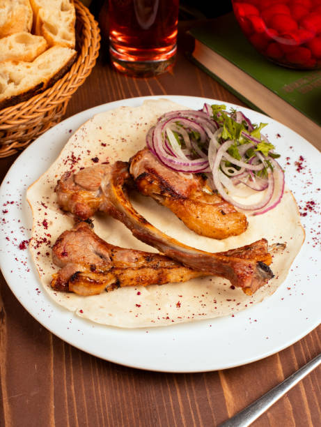 istock Beef, lamb rack kebab served with onion slices. 1157224480