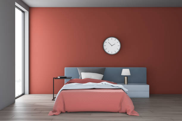 istock Red and white bedroom interior with clock 1157225602