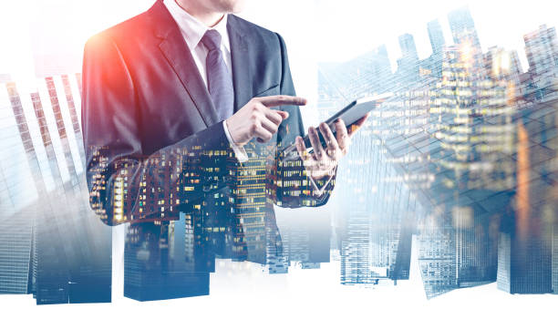 istock Businessman with tablet in city 1157225724