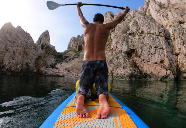 istock Man with an oar in his raised arms 1157227463