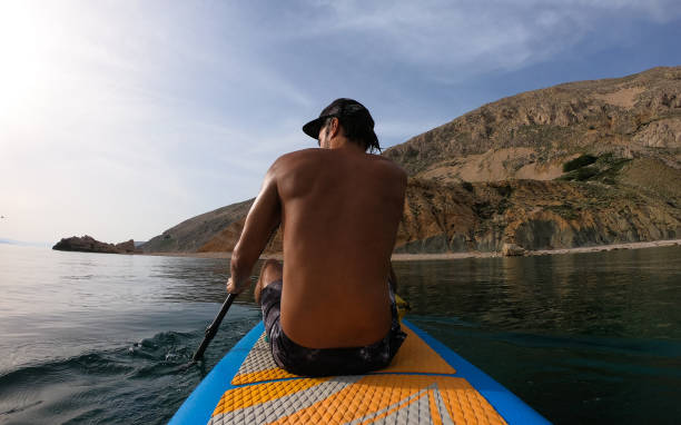 istock Man paddling over sea closeup 1157227476