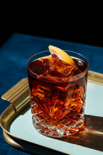 Negroni, an italian cocktail Negroni, an italian cocktail, is an apéritif first mixed in Florence in 1919. Count Camillo Negroni asked to strengthen his Americano by adding gin rather than normal soda water. vermouth stock pictures, royalty-free photos & images