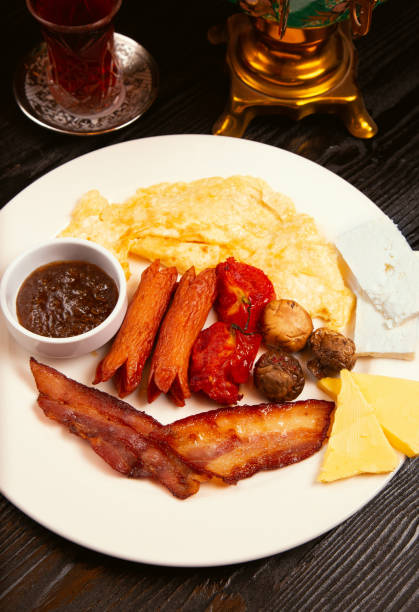 istock Breakfast plate with crepe, jam, fried sausages. 1157230132