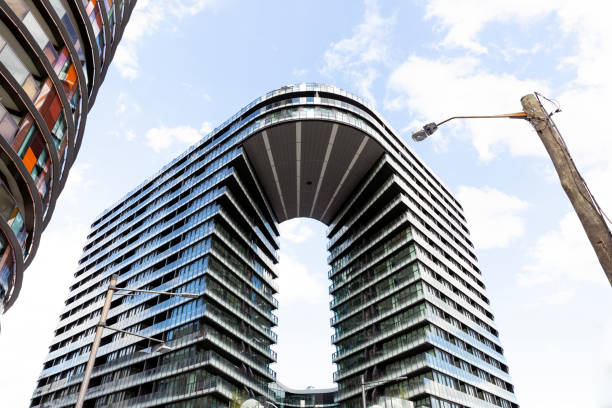 istock Low angle view of modern apartment building, sky background with copy space 1157233395