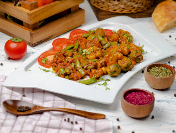 istock Roasted cauliflower with sprouts, beans and served with tomato sauce and herbs. 1157234965
