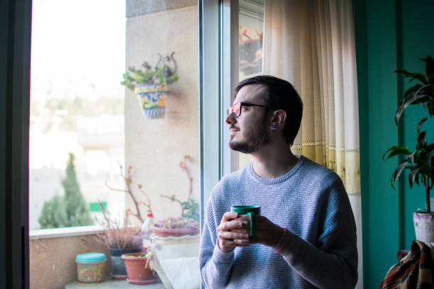 istock Man talking with phone close up window 1157235030