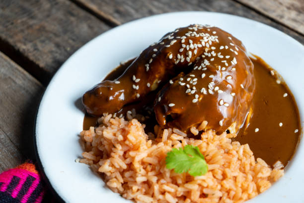 istock Mexican chicken with mole sauce and red rice 1157235293