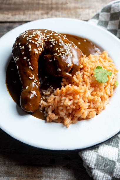 istock Mexican chicken with mole sauce and red rice 1157235894