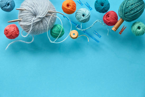 istock Various wool yarn and knitting needles, creative knitting hobby background 1157237059