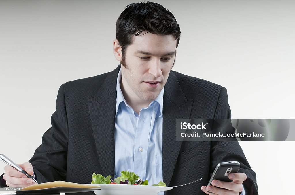 Multitareas ejecutivo - Foto de stock de Comer libre de derechos