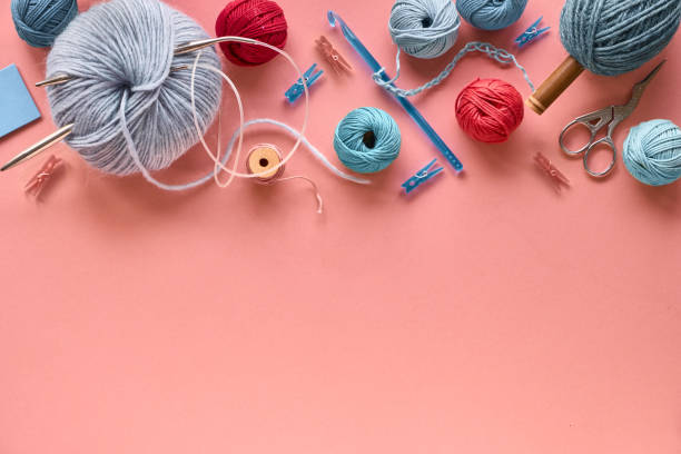 istock Various wool yarn and knitting needles, creative knitting hobby background 1157239004