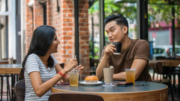 istock Young couple sitting in restaurant 1157239311