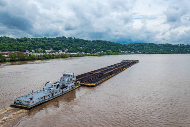 Barge Pushing Coal Containers on the Ohio River Medium Shot