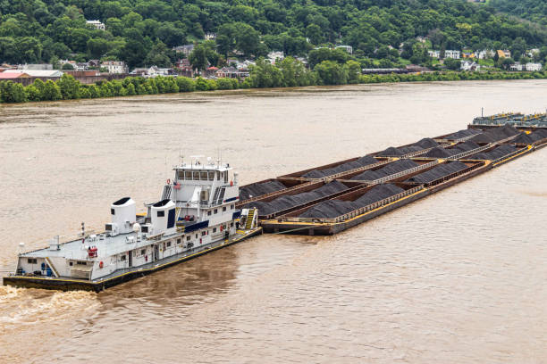 istock Barge Pushing Coal Containers on the Ohio River Close Shot 1157243341