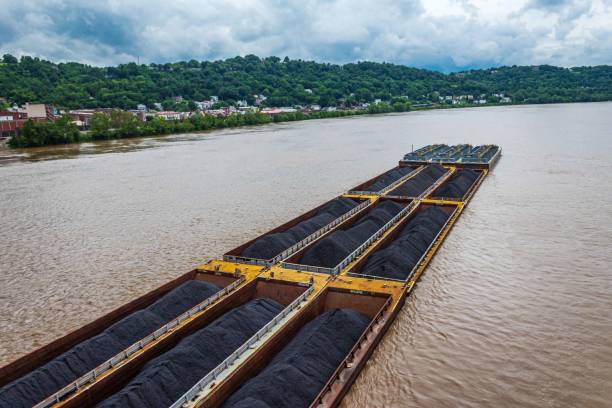 istock Coal Barge Floating Down the Ohio River Closeup 1157243342