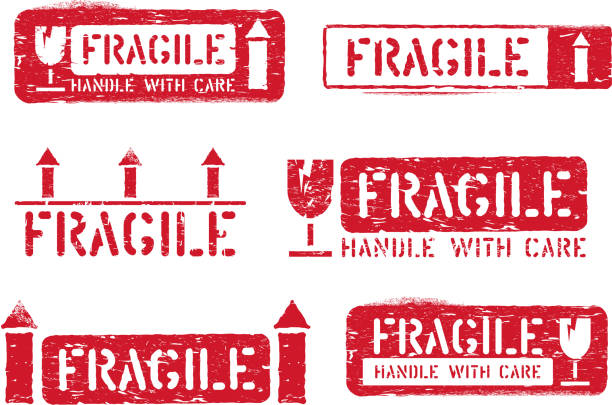 istock Fragile, this way up, handle with care grungy stamps. Vector ink set of cargo box signs for delivery 1157243921