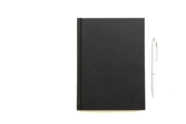 istock office supplies note pad pen white background 1157244352