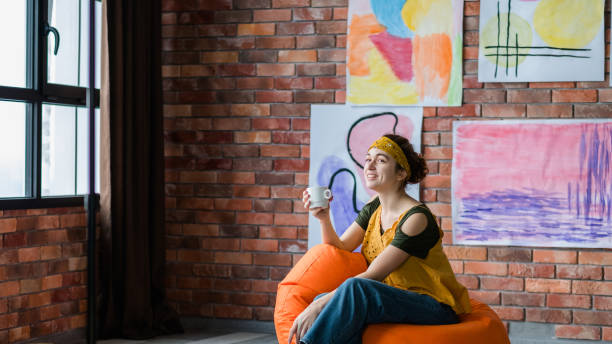 istock creative lifestyle successful female artist studio 1157244396