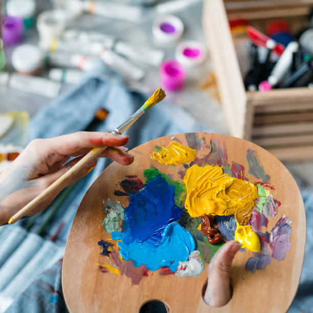 istock artist essential tools wooden palette paintbrush 1157244409