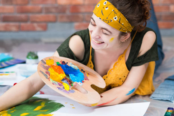 istock home art studio happy female painter palette 1157244414