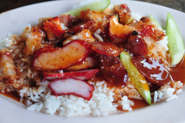 istock Barbecued red pork in sauce with rice 1157247100