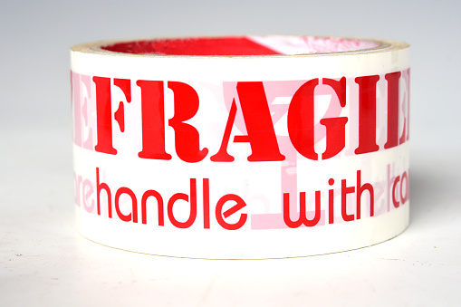 Roll of fragile tape on the White Blackground