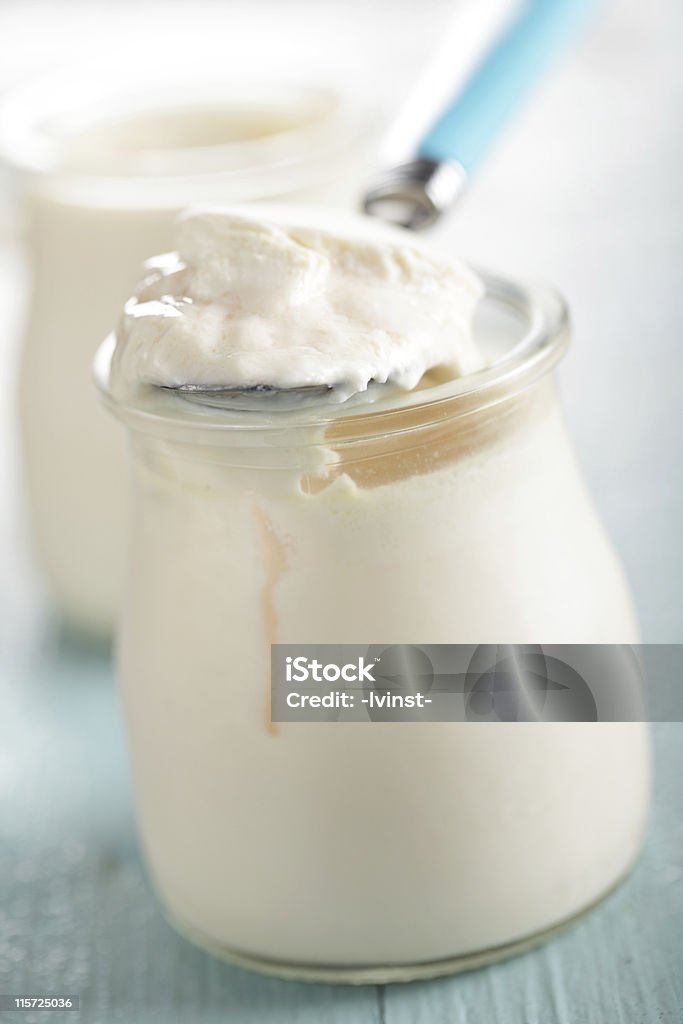 Yogurt Homemade yogurt in the glass jar closeup Blue Stock Photo