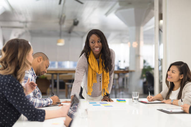 istock Black female CEO leads a team meeting 1157251579