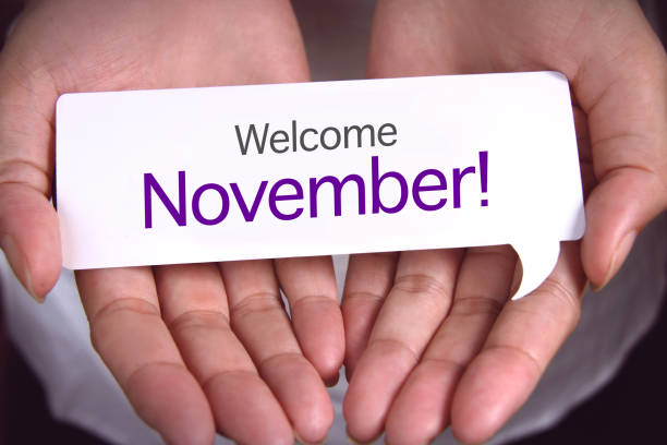 istock Hand showing welcome November. 1157255810