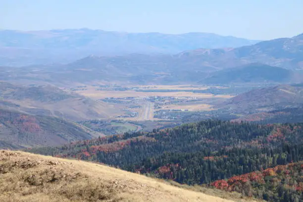 The roads and highways of the valley and Morgan county can be seen clearly from the top of Big Mountain in the Wasatch Range of Utah.