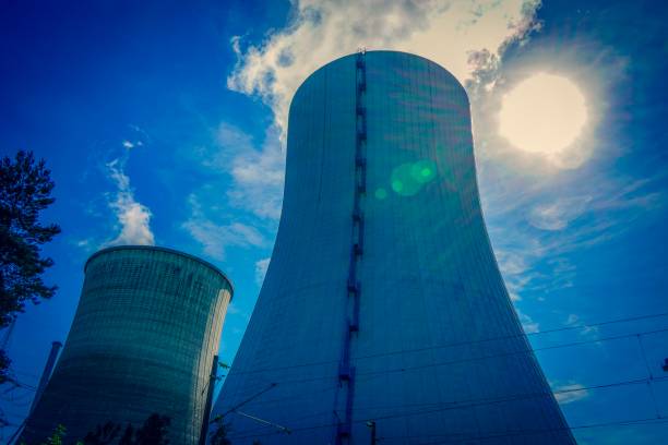 Picture shows a nuclear power station in a shining sun.