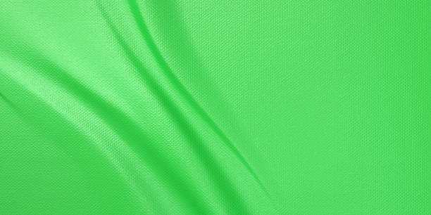 istock Green texture with folds, fabric cloth material banner, 1157260078