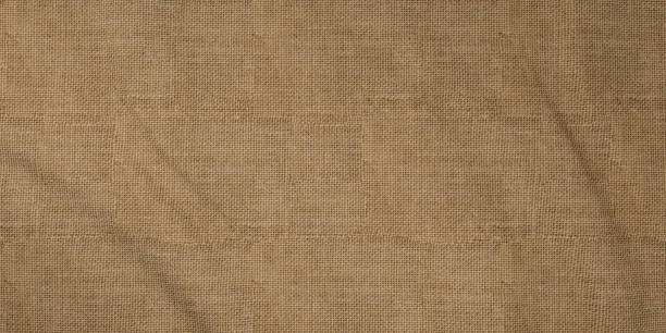 istock Sackcloth canvas fabric cloth folds background 1157260087
