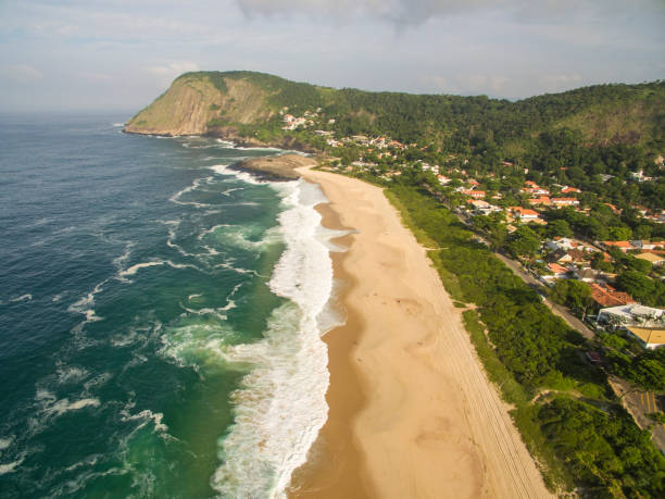 istock Stone beach and mountain. Beach paradise. Itacoatiara beach. 1157261400