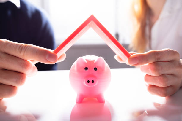 istock Human Hand Protecting Pink Piggybank 1157269304