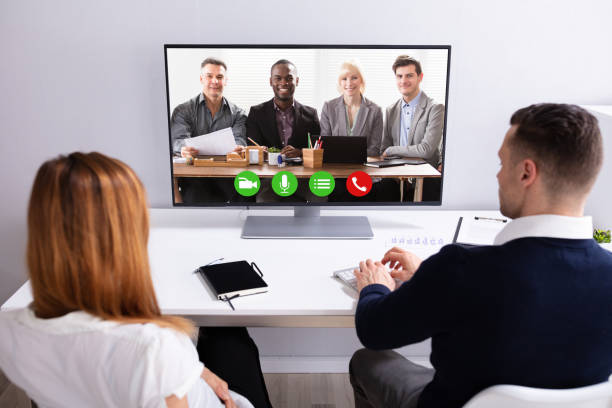 istock Businesspeople Video Conferencing With Their Partner On Computer 1157269313