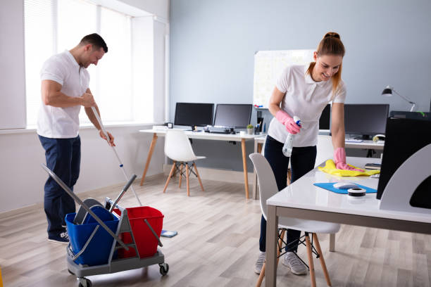 istock Smiling Two Young Janitor Cleaning The Office 1157269323