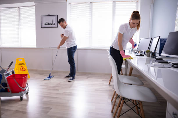 istock Smiling Two Young Janitor Cleaning The Office 1157269327