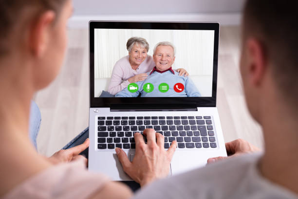 istock Couple Video Conferencing With Their Parents On Laptop 1157269358