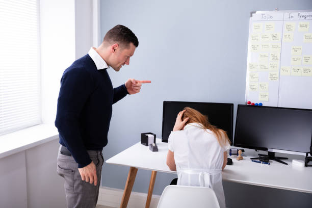 istock Angry Businessman Shouting At Female Executive 1157269567