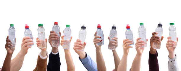 istock Different People Holding Water Bottles In A Row 1157270469