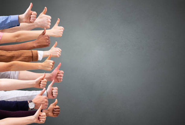 istock People Hand Showing Thumb Up Sign Against Green Backdrop 1157270488