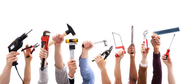 istock Group Of People's Hand Holding Carpentry Tools 1157270491