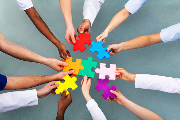 istock High Angle View Of Medical Team Solving Jigsaw Puzzle 1157270504