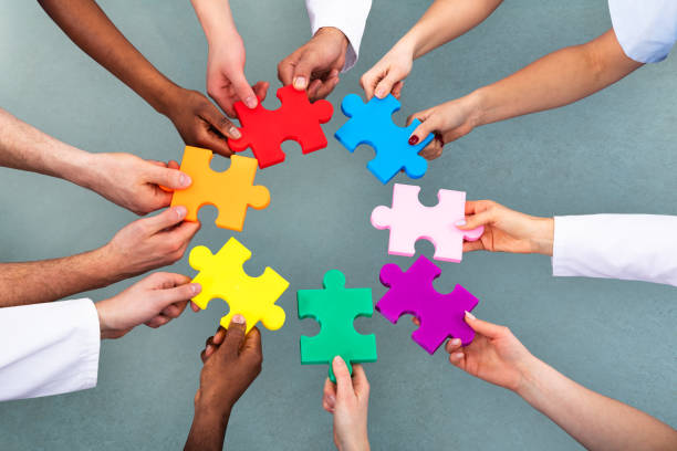 istock High Angle View Of Medical Team Solving Jigsaw Puzzle 1157270505