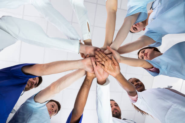 istock Directly Below Shot Of Doctor Stacking Hands Together 1157270515